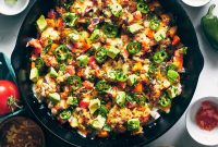 Spicy Cauliflower Nachos with Melted Cheese & Jalapeños