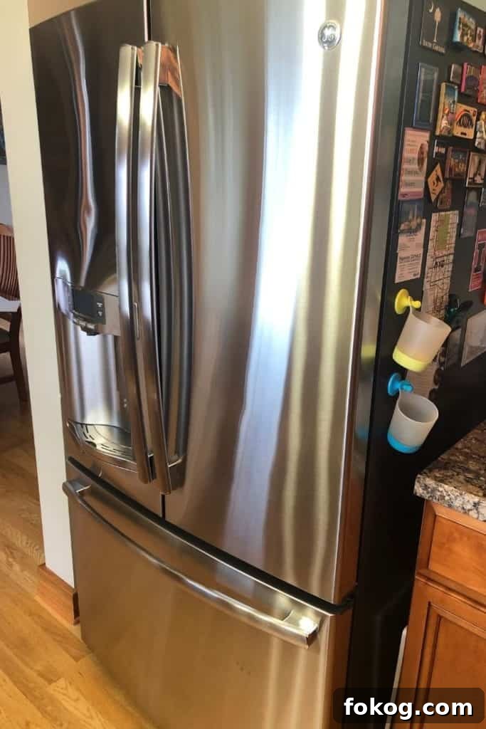 A shiny and clean french door refrigerator.