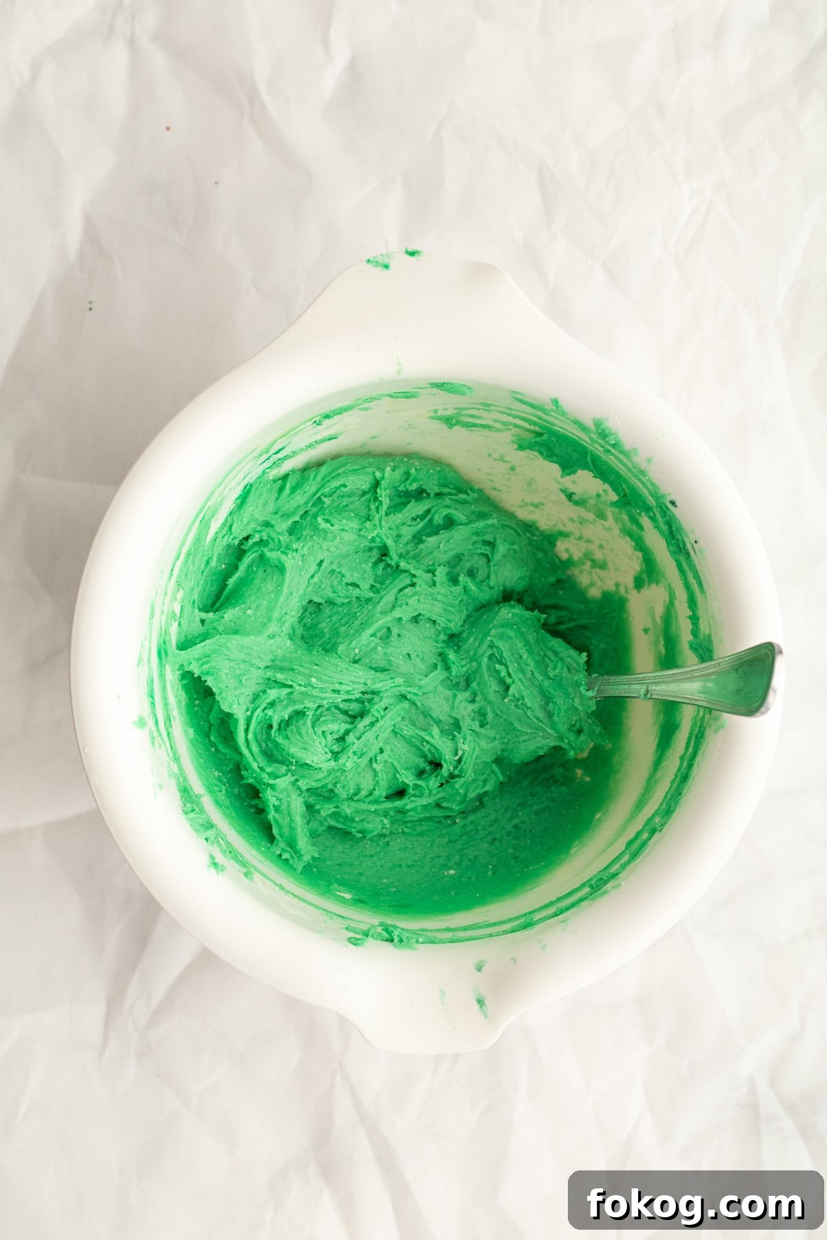 green cookie dough batter in a white bowl