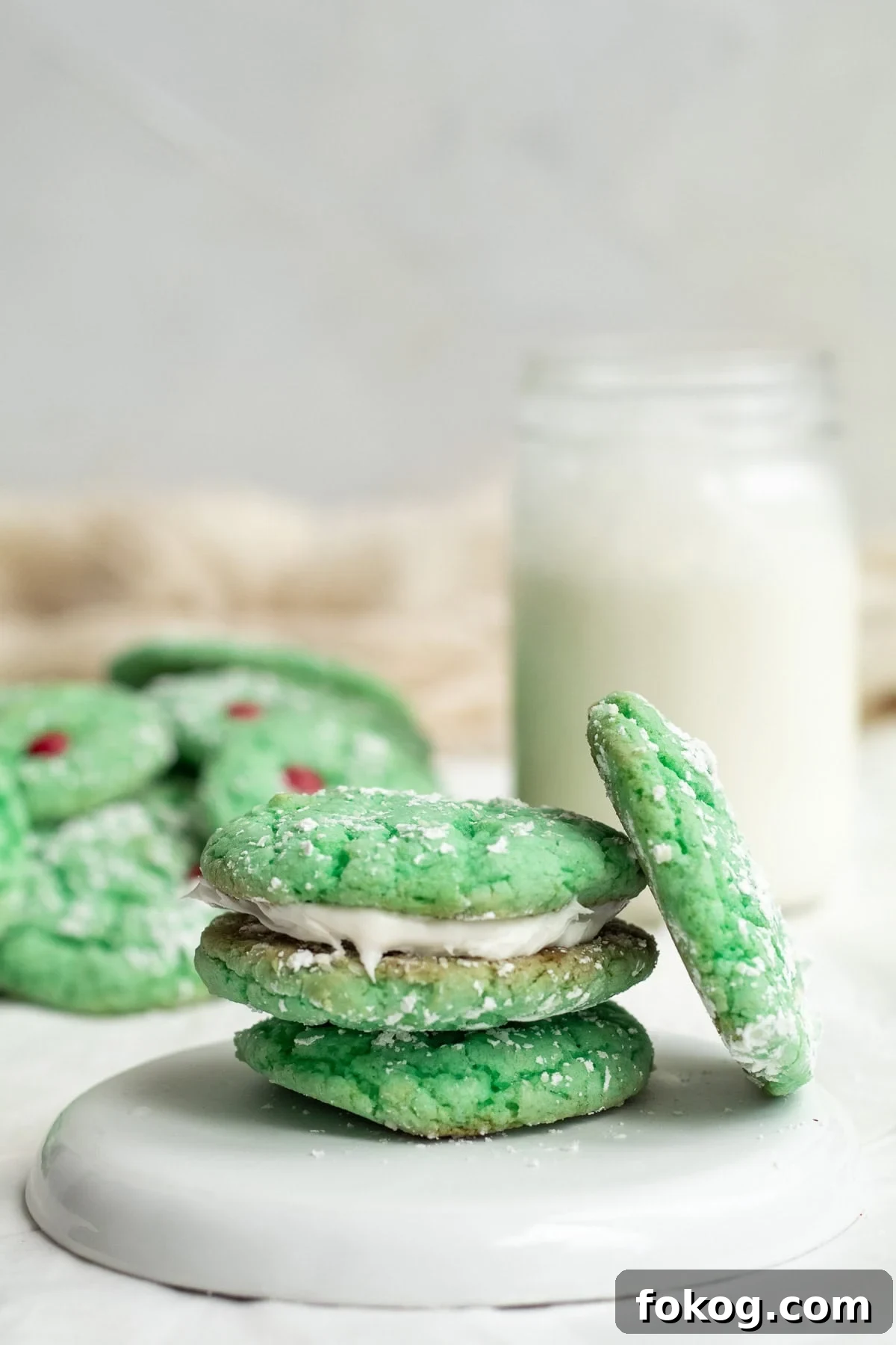 green sandwich cookies on a white plate