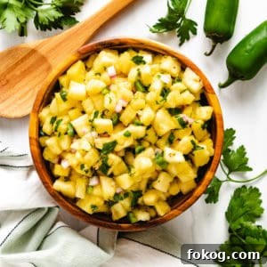 Spicy Jalapeño Pineapple Salsa Recipe for Grilling and Tacos 5 Top down view of jalapeno salsa with diced pineapple.