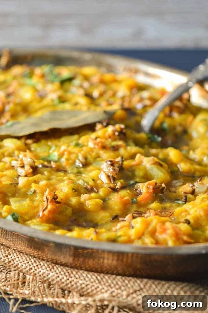 Restaurant-Style Dal Tadka Recipe Ready in 25 Minutes 2 A silver bowl with dal tadka in it