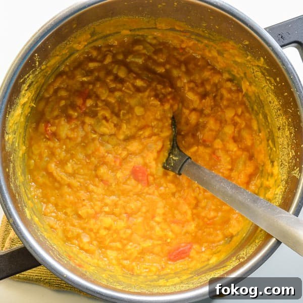 Restaurant-Style Dal Tadka Recipe Ready in 25 Minutes 6 Cooked yellow lentils in a pot