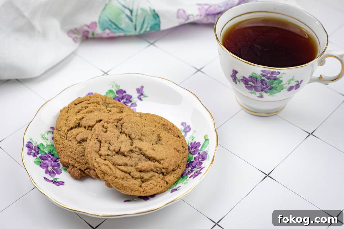 A plate of Spiced Ginger Cookies and a cup of tea.