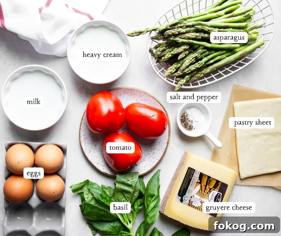 Heavy cream, milk, asparagus, salt and pepper, tomatoes, pastry sheet, eggs, gruyere cheese, fresh basil and a white and red dish towel. 