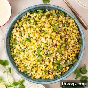 Mexican Street Corn Salad (Grilled Elote-Style) 7 turquoise bowl filled with grilled corn salad