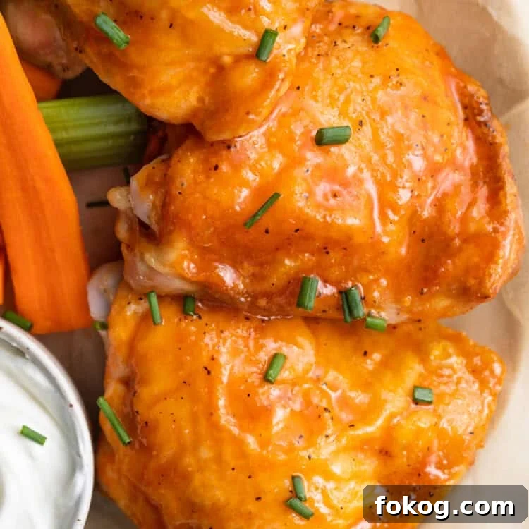 close up image of buffalo chicken thighs on a plate