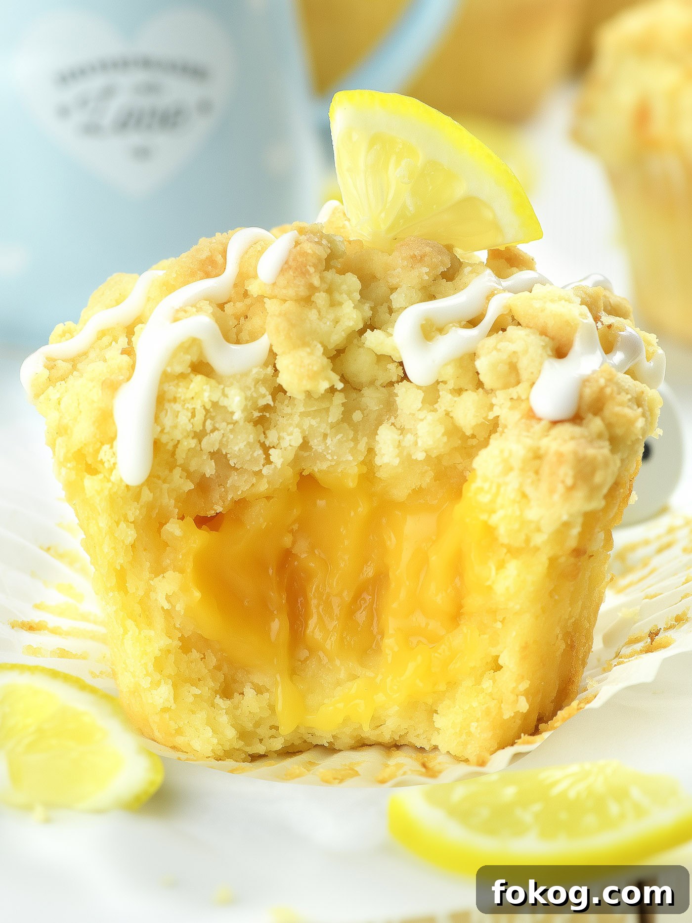 Lemon Curd Muffins with Zesty Citrus Filling 2 lemon curd muffin with creamy lemon filling and glaze on top