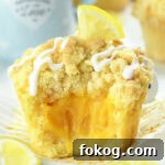 lemon curd muffins with soft crumb and gooey lemon filling inside