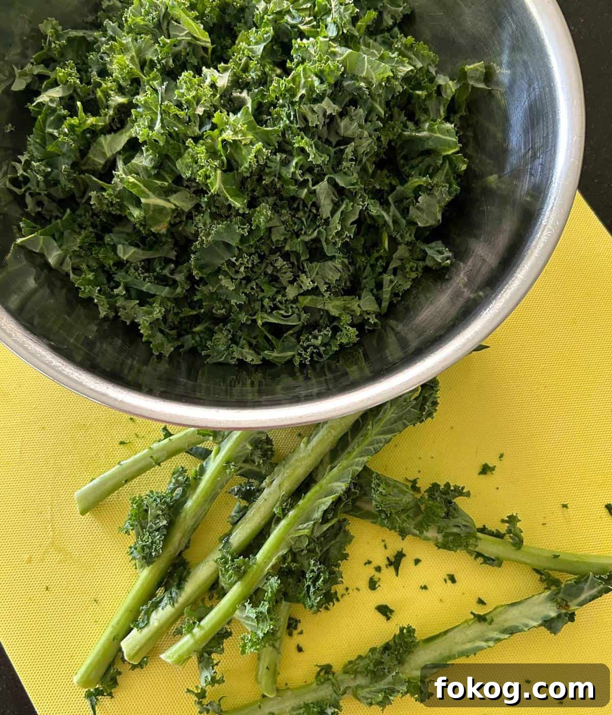 Removing stalks from kale.