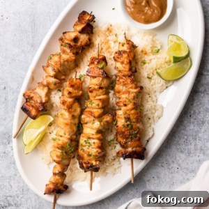 Air Fryer Chinese Chicken Skewers Recipe with Sticky Glaze 9 The completed Chinese chicken on a stick recipe on a platter with jasmine rice.