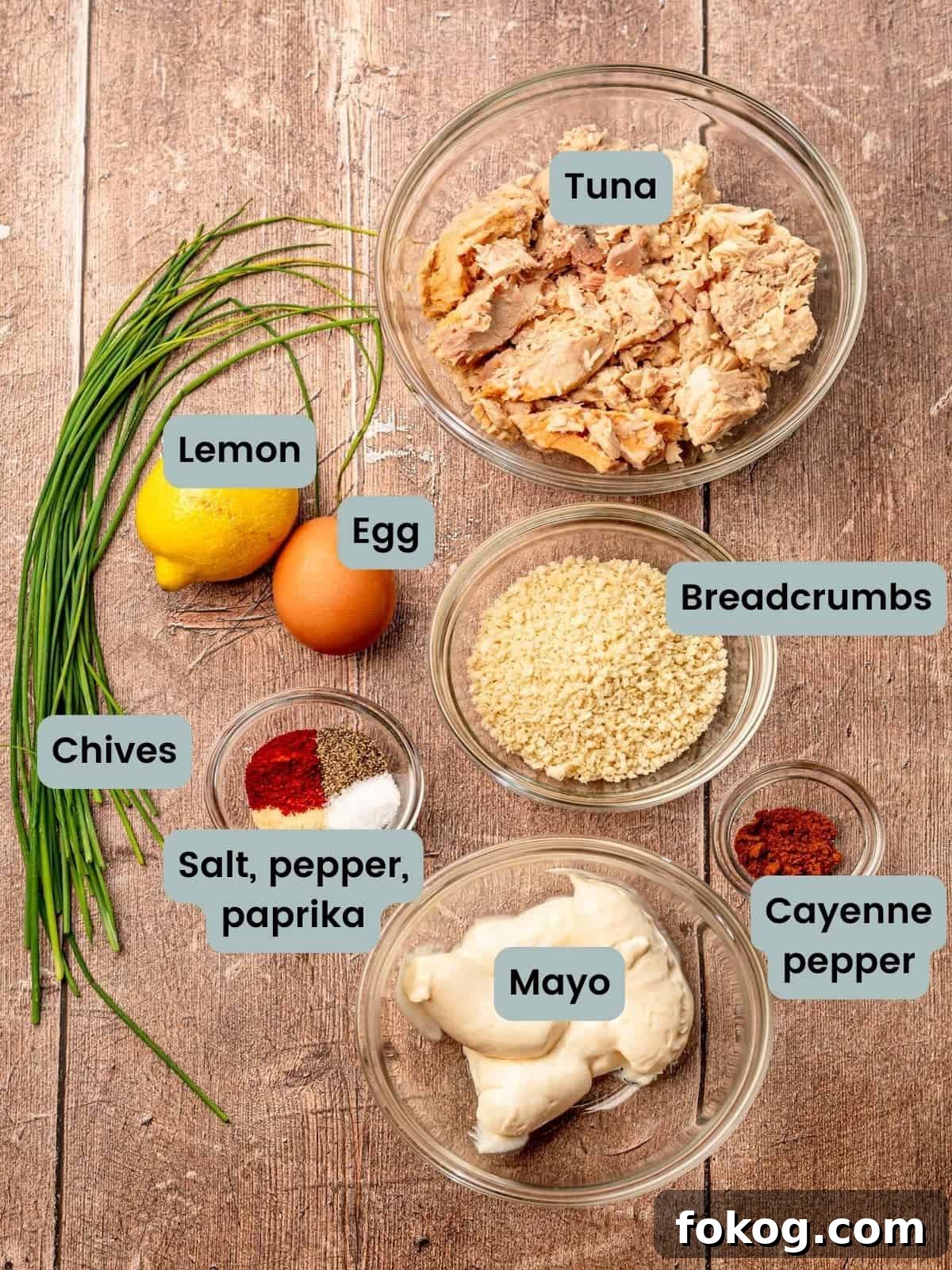 Tuna cake ingredients measured out in bowls and labeled.