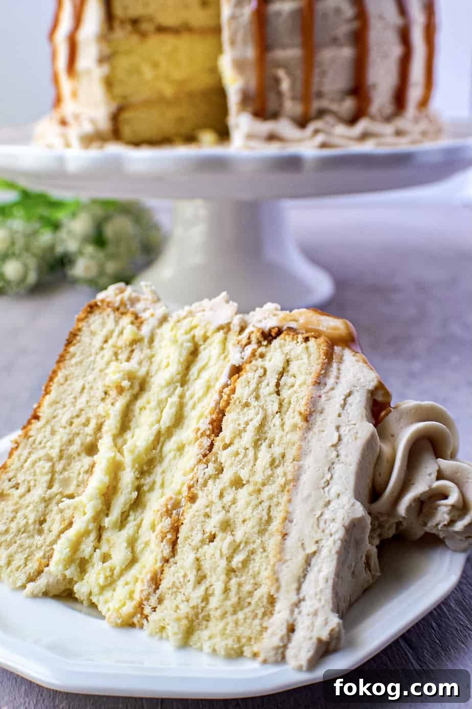 close up of caramel cheesecake layer cake