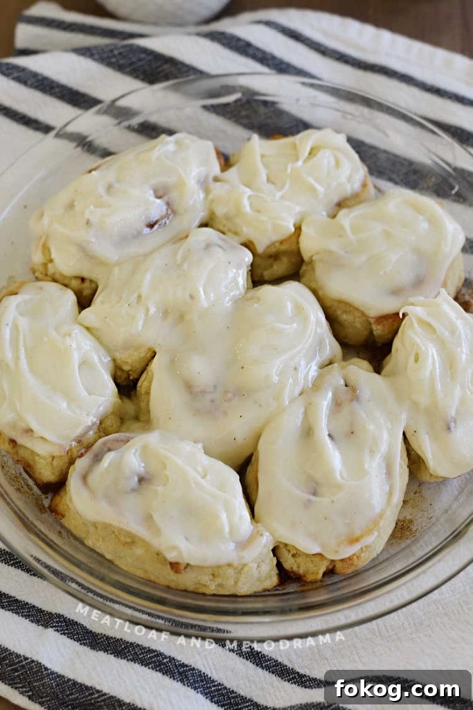 frosted cinnamon rolls in pie pan