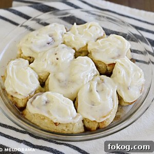 cinnamon rolls made from 2 ingredient dough with cream cheese frosting in a pie pan