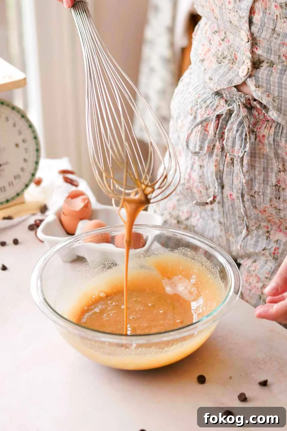 Decadent Pecan Pie Brownies Recipe — Gooey Pecan Swirl Dessert 12 eggs and sugar whisked in a glass bowl