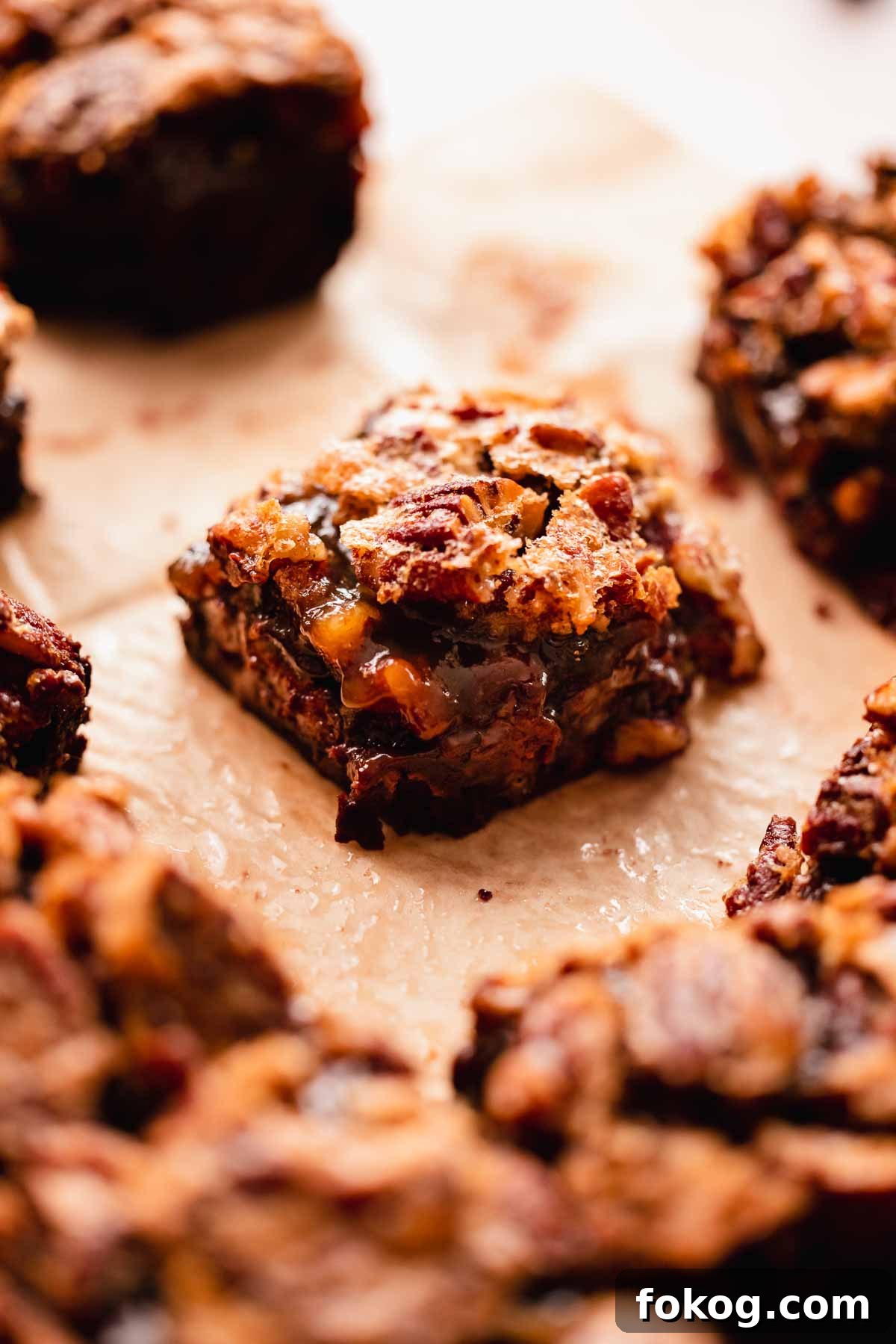 Decadent Pecan Pie Brownies Recipe — Gooey Pecan Swirl Dessert 18 separate brownie square with a gooey layer inside and crusted pecan top