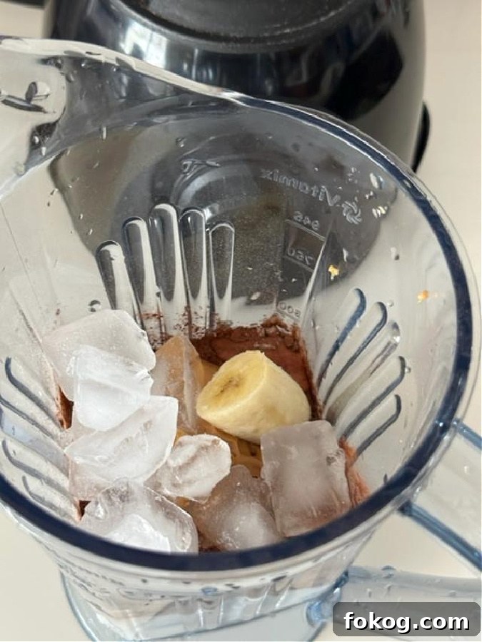 Almond Milk Peanut Butter Chocolate Smoothie Recipe 4 Smoothie pouring into glass