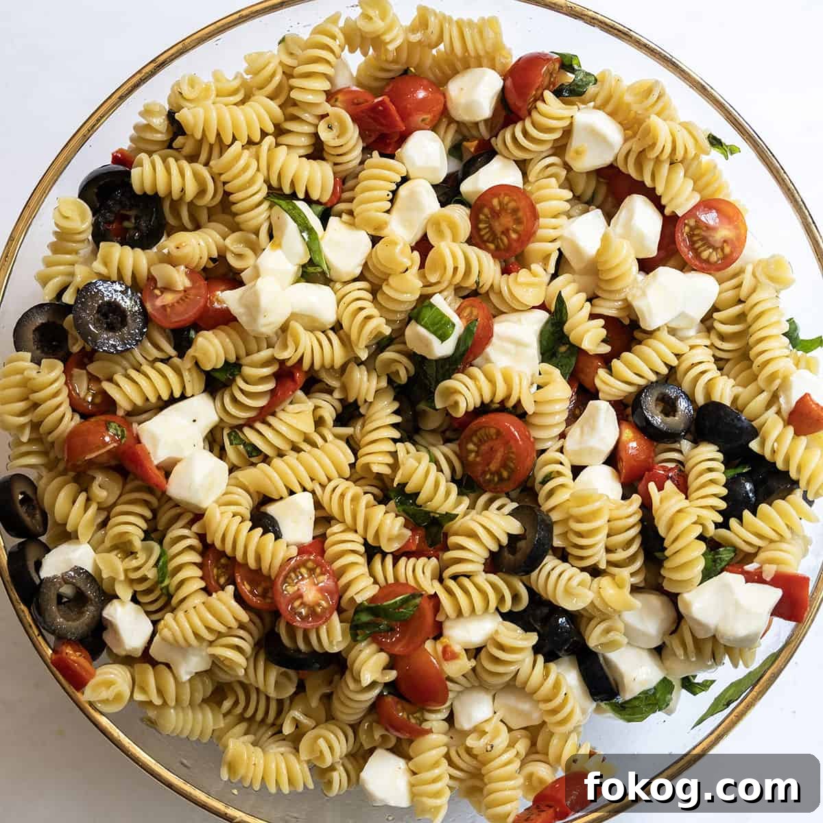 Classic Italian Pasta Salad Recipe with Tangy Vinaigrette and Veggies 8 All of the ingredients combined in a bowl.