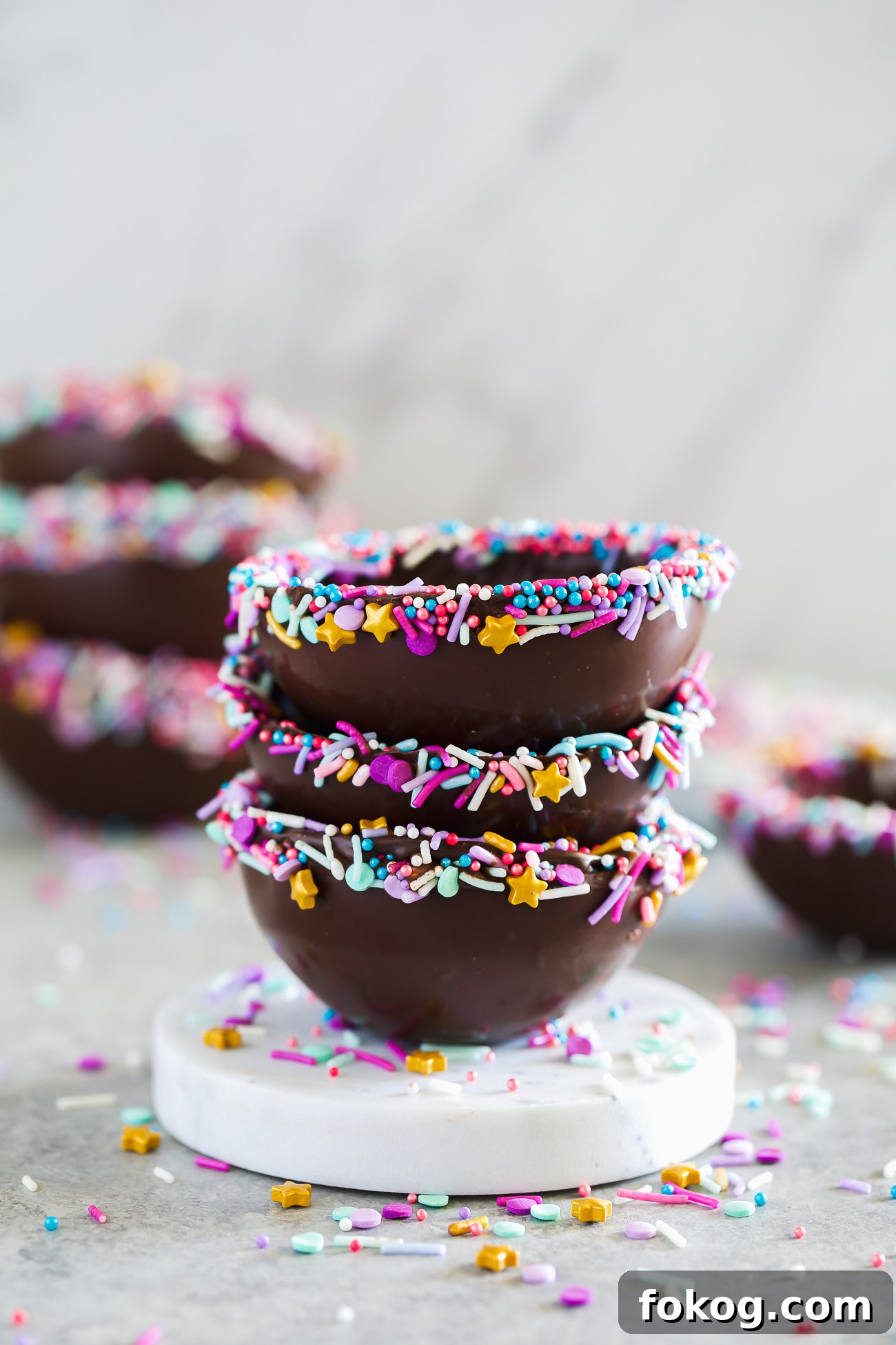 Edible Chocolate Dessert Bowls: How to Make and Fill Them 5 chocolate bowls made from a silicone mold decorated with sprinkles