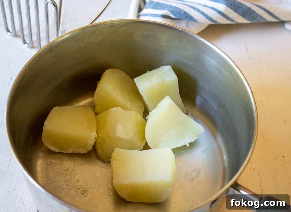 Cubed potatoes in a pot.
