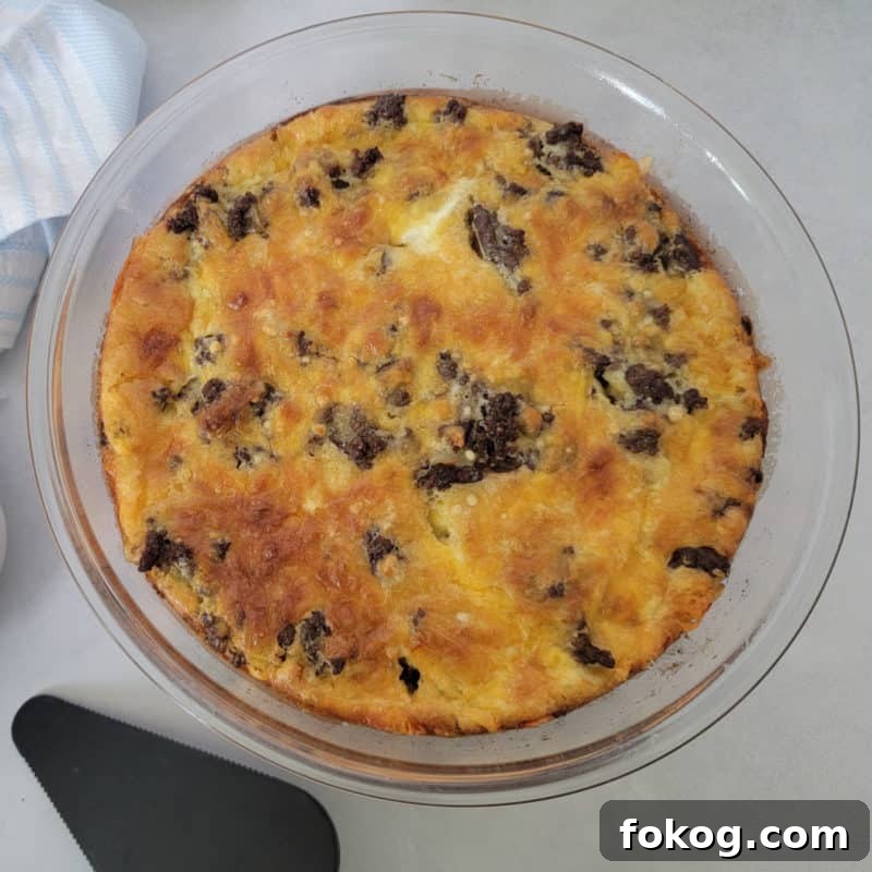 Simple Bisquick Recipes for Delicious Breakfasts and Snacks 8 Bisquick impossible cheeseburger pie in a glass pie pan with a spatula