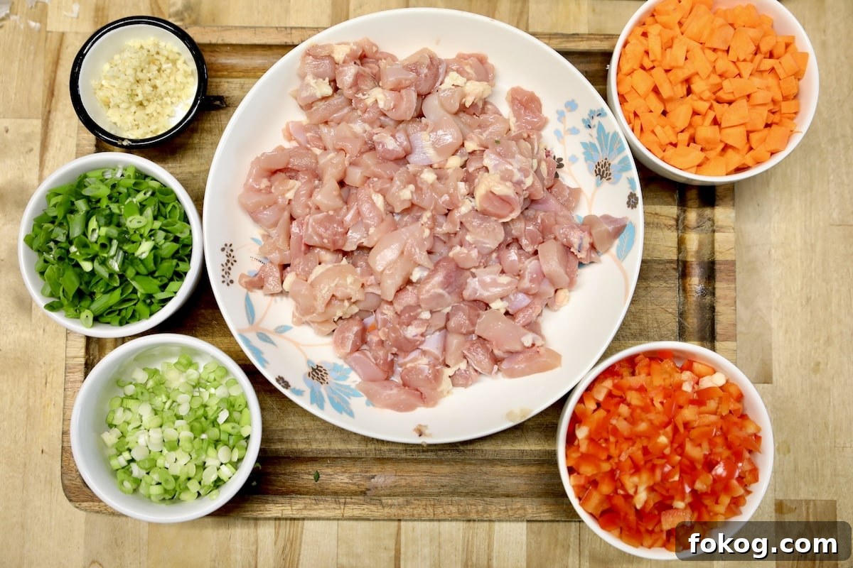 Ingredients for chicken fried rice with vegetables.