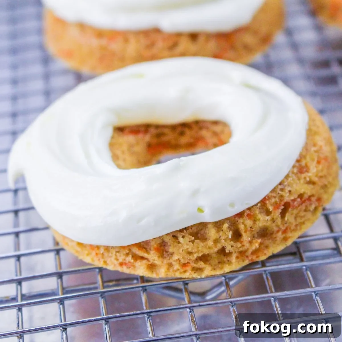Close up looking at a carrot cake donut.