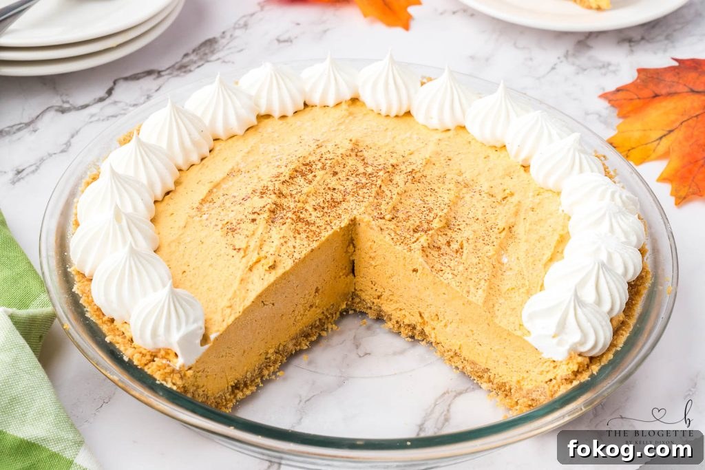 Pumpkin Fluff Pie is a pumpkin cream pie with a graham cracker crust. If you're craving a cold and creamy pumpkin spice treat, this one is for you!