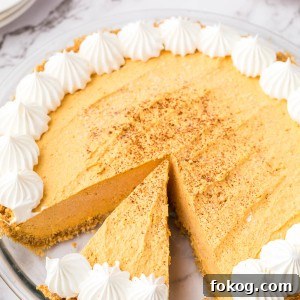 Pumpkin Fluff Pie is a pumpkin cream pie with a graham cracker crust. If you're craving a cold and creamy pumpkin spice treat, this one is for you!