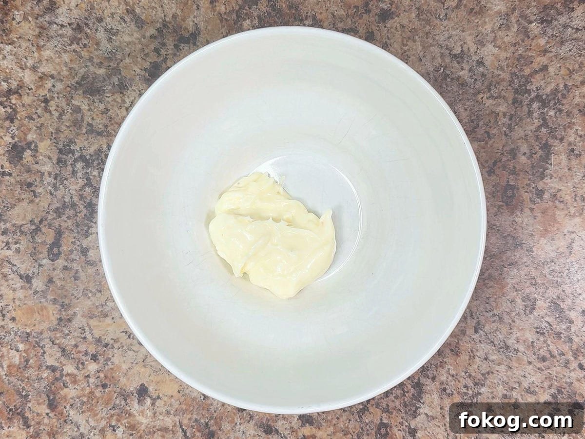 Mini Corn Dog Bites Recipe: Crispy, Bite-Sized Snack Ideas 24 Mayonnaise in a mixing bowl.