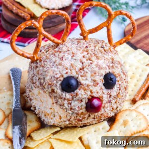 The reindeer cheeseball with a small piece taken off of it so you can see the interior.