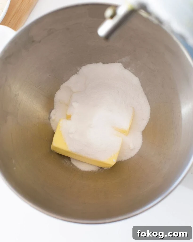 Butter and sugar in a stand mixer bowl.