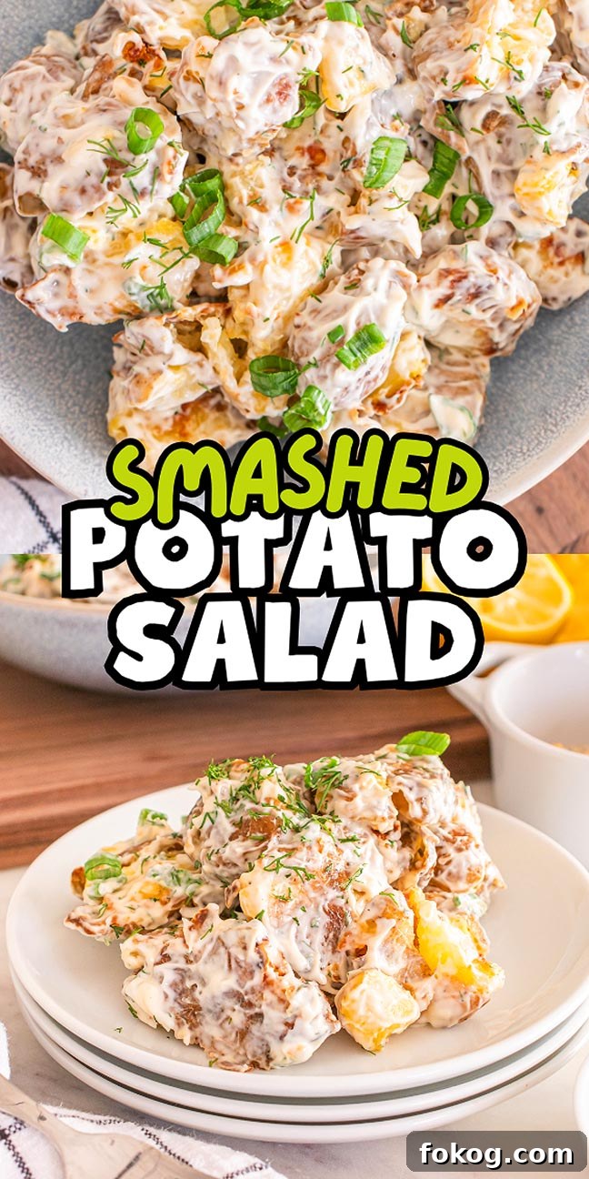 A plate of delightful smashed potato salad, vibrant with chopped green onions, sits elegantly on a white dish. In the background, a larger serving awaits. 