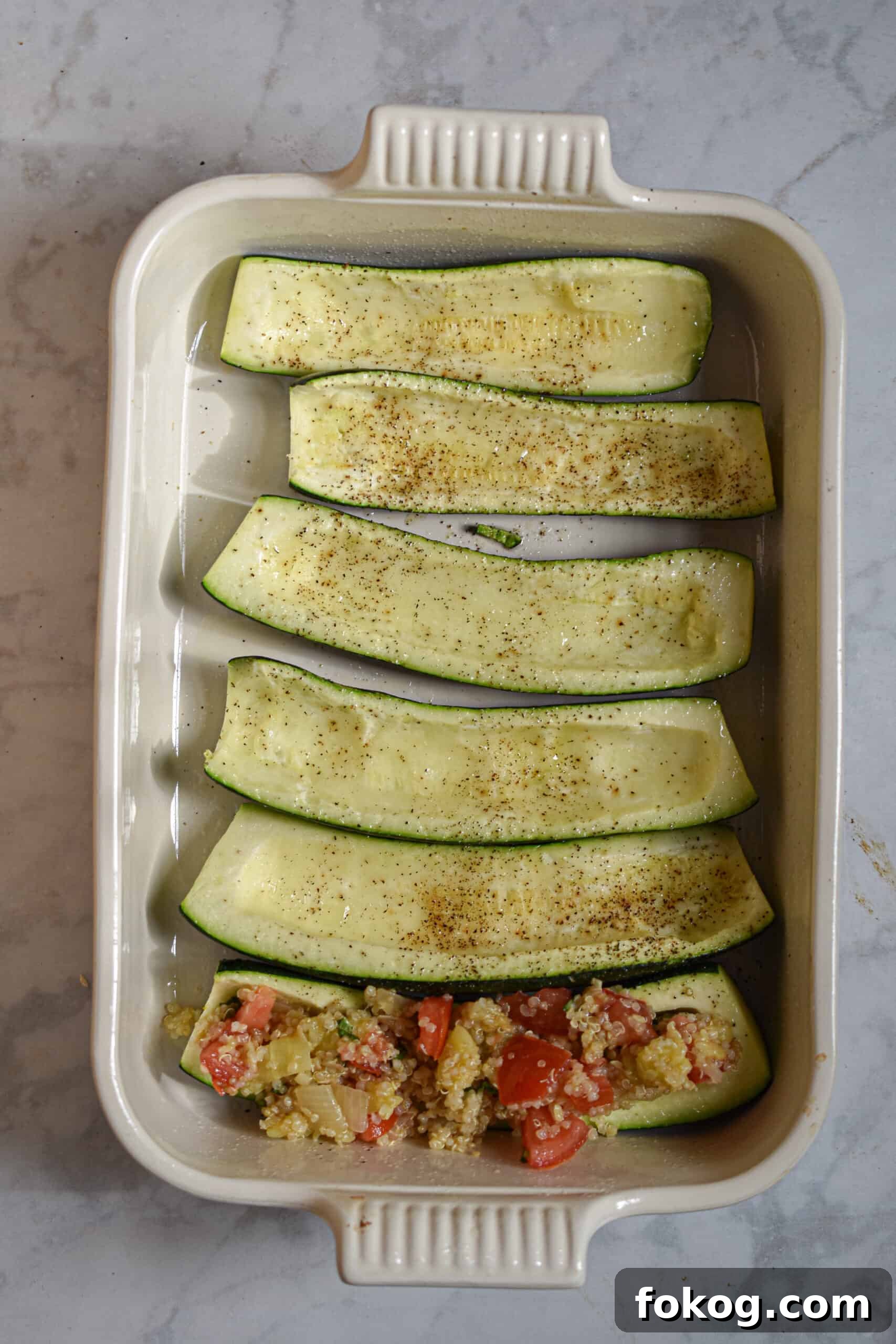 Quinoa-Stuffed Zucchini Boats with Herbs and Lemon 7 Fill the zucchini boats with quinoa mixture