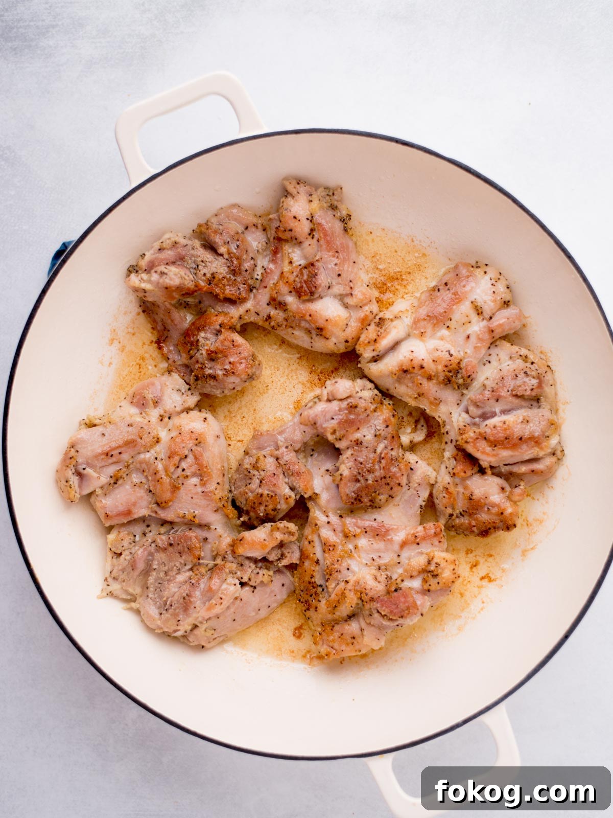 Crispy Buffalo Chicken Thighs Recipe for Dinner 5 buffalo chicken thighs searing in a skillet