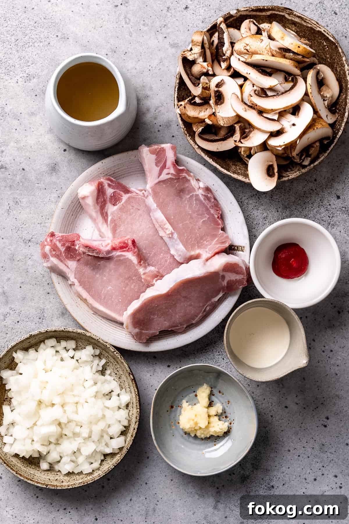Ingredients for crock Pot pork chops with mushroom sauce on a table.