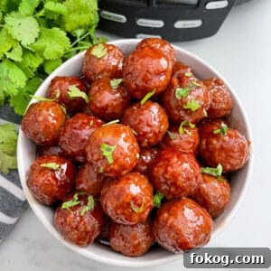 close up image of slow cooker grape jelly meatballs