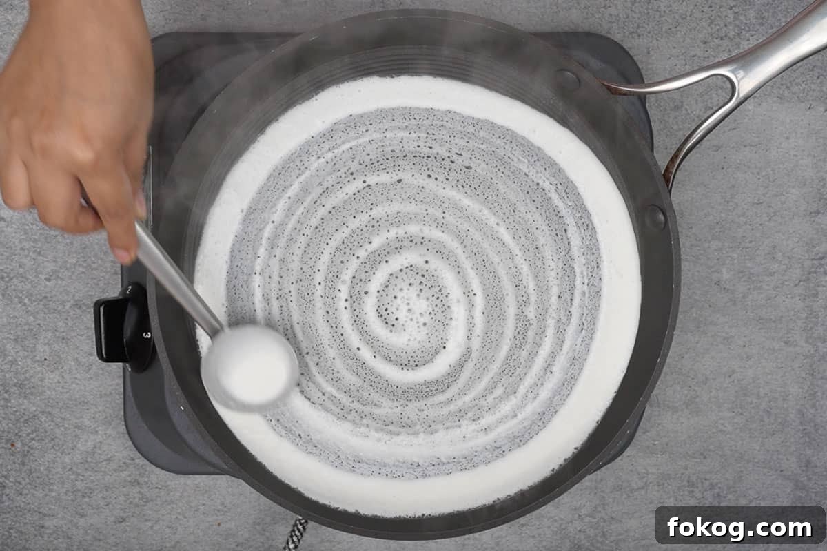 Crispy Egg Dosa (Mutta Dosa) Recipe for Perfect Breakfast 4 Dosa batter spread to make thin dosa.