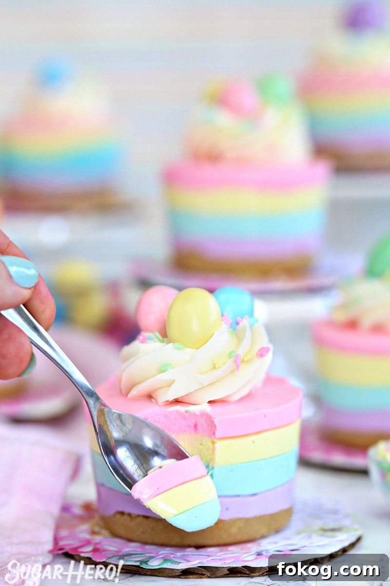 Easter no-bake mini cheesecake with a spoonful on a metal spoon in front of the cheesecake.