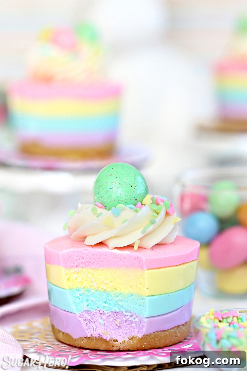 Easter no-bake mini cheesecake topped with frosting, sprinkles and a candy egg.