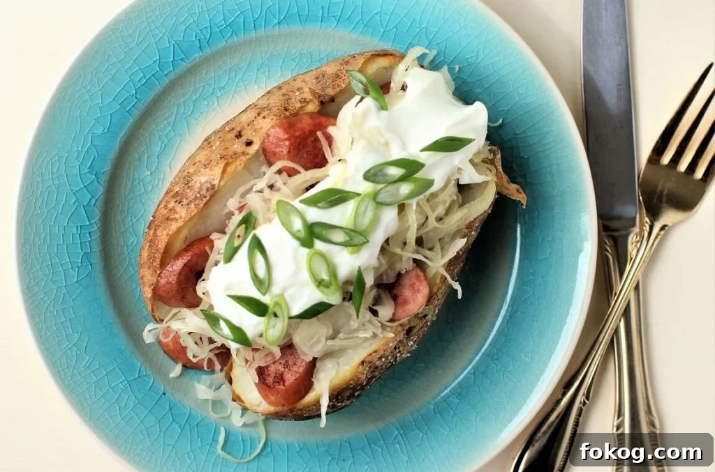 Creamy Tuna Stuffed Baked Potatoes + 44 Savory Topping Ideas 5 baked potato, split and topped with sausages, sauerkraut, and sour cream