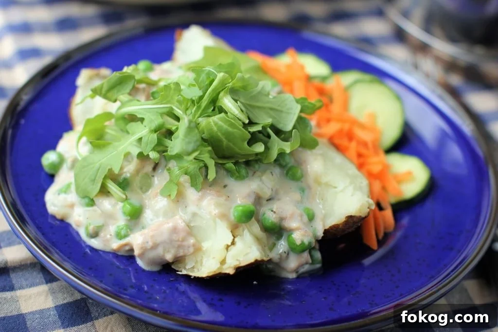 Creamy Tuna Stuffed Baked Potatoes + 44 Savory Topping Ideas 7 baked potato, split and topped with creamed tuna and arugula