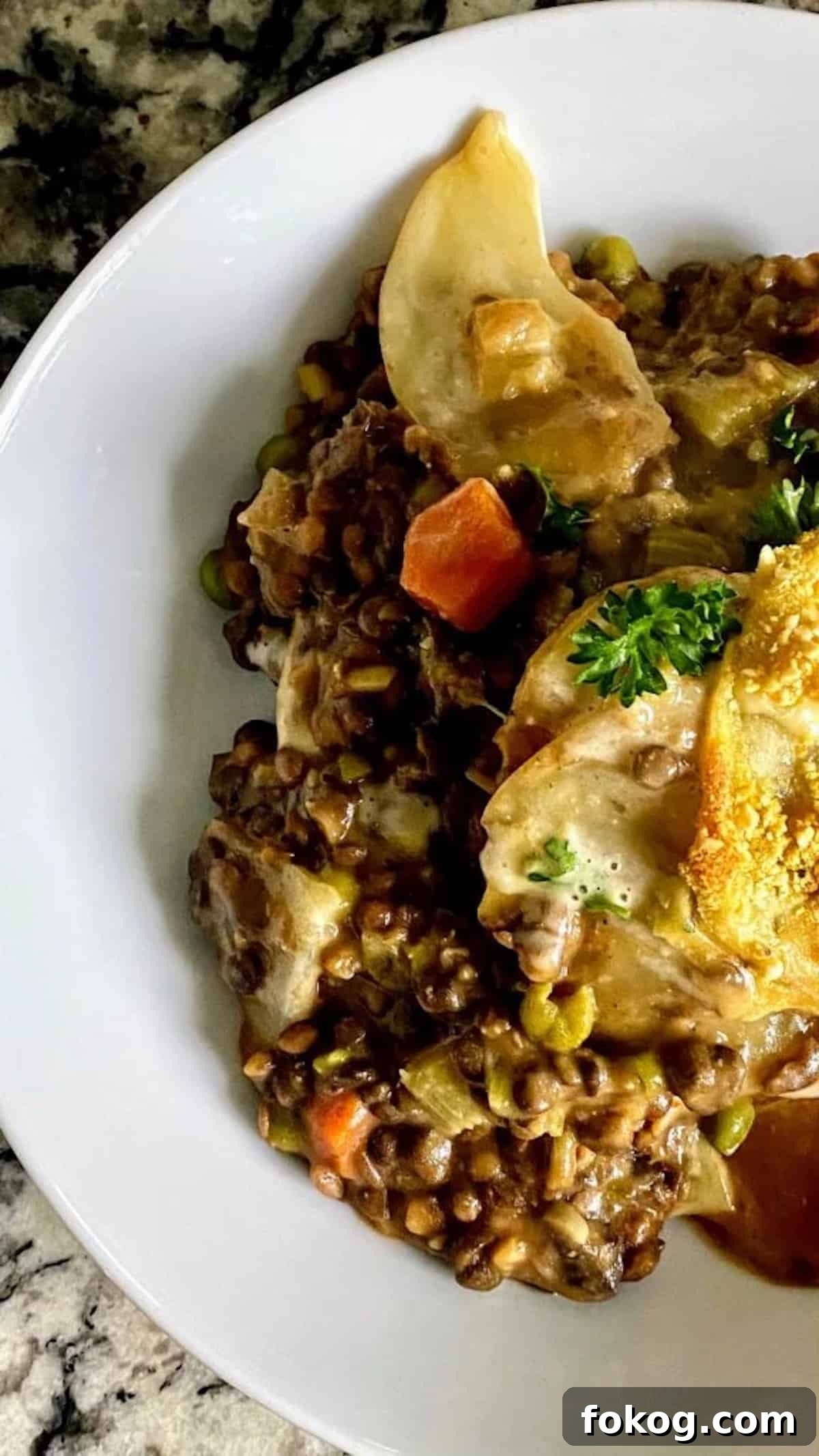 Hearty Vegan Shepherd's Pie Recipe for Comforting Weeknight Dinner 3 Vegan shepherd's pie recipe in a bowl on the table.