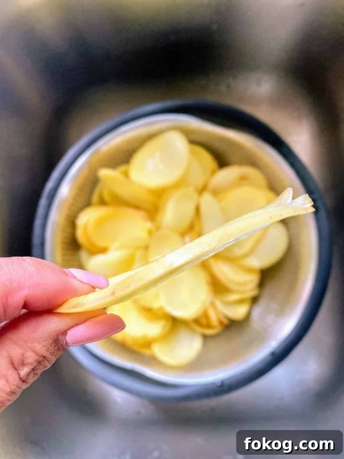 Hearty Vegan Shepherd's Pie Recipe for Comforting Weeknight Dinner 4 Cut the potatoes into thin and even slices using a mandoline.