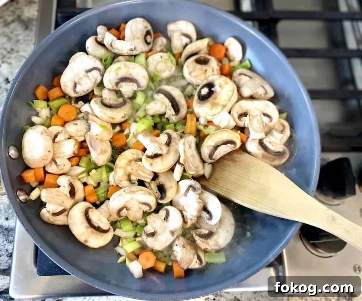 Hearty Vegan Shepherd's Pie Recipe for Comforting Weeknight Dinner 5 I am sauteing the mushrooms and other vegetables in a skillet on the stove for the cottage pie.
