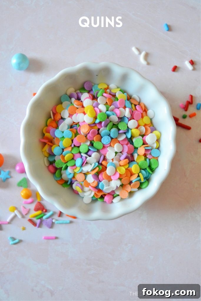 rainbow quin sprinkles in a small white bowl
