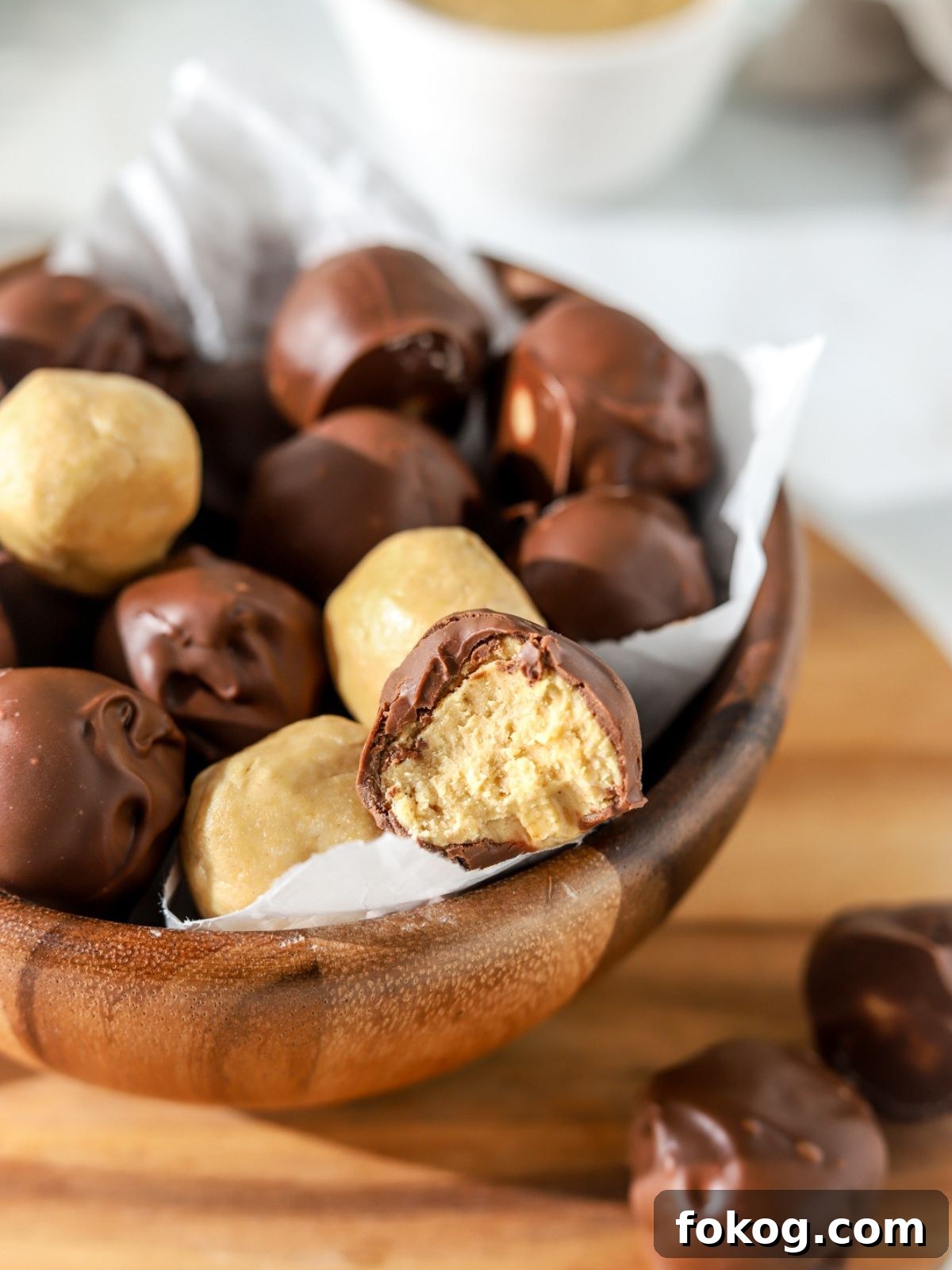 No-Bake Peanut Butter Balls Recipe: Quick Treats for Parties 10 A peanut butter chocolate ball with a bite taken out