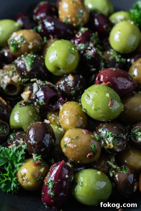 Green, black and Kalamata marinated olives with garlic and fresh herbs