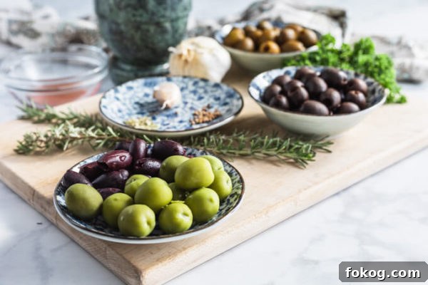 Marinated olives ingredients: assorted olives, spices, garlic, rosemary and parsley 